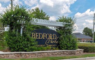 a sign on the side of the road at Bedford Parke Apartments, Warner Robins, GA