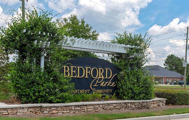 a sign on the side of the road at Bedford Parke Apartments, Warner Robins, GA