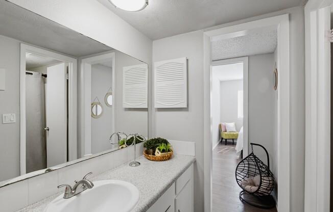 Welcome to Wymore 360 Apartments, where modern design meets functionality. This chic bathroom features elegant fixtures and ample storage, perfect for your everyday needs. Elevate your lifestyle today and schedule a tour!