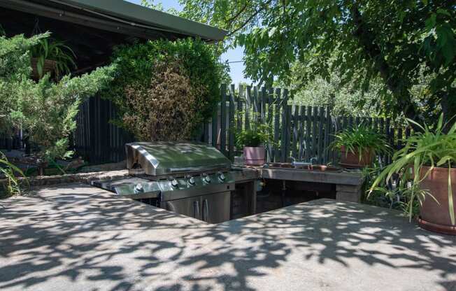 BBQ area at Driftwood Village with gas grill