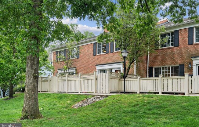 Welcome to this beautifully updated three bedroom, two and a half bath brick townhome in the sought after Parkside at Alexandria.