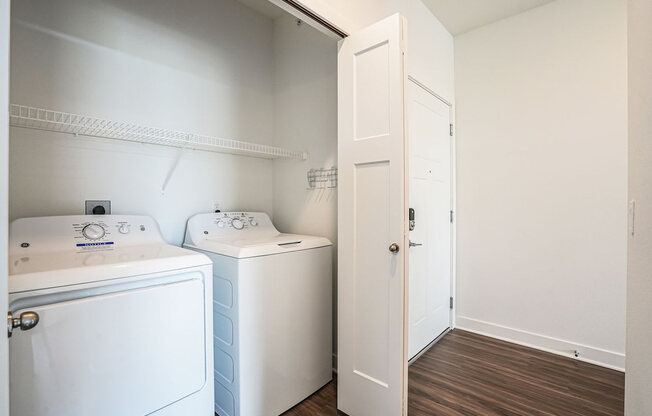 a laundry room with a washer and dryer at Meadowbrooke Apartment Homes, Grand Rapids, Michigan