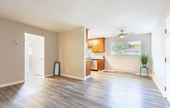 an empty living room and kitchen with a wood floor at Element LLC, Sunnyvale, CA, 94086