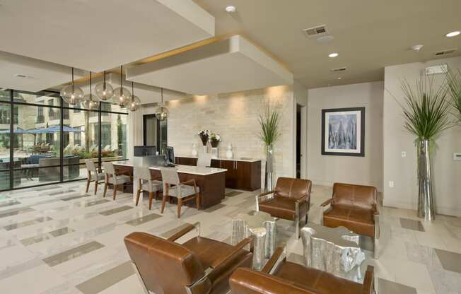 a living room with a table and chairs and a lobby
