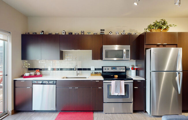 a kitchen with a stove top oven next to a refrigerator