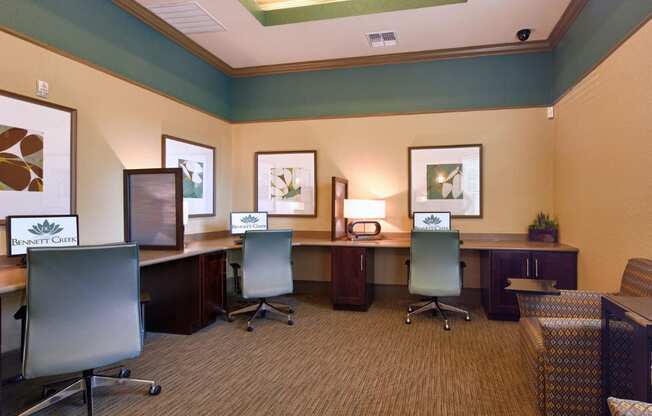 A room with a carpeted floor and a green chair.