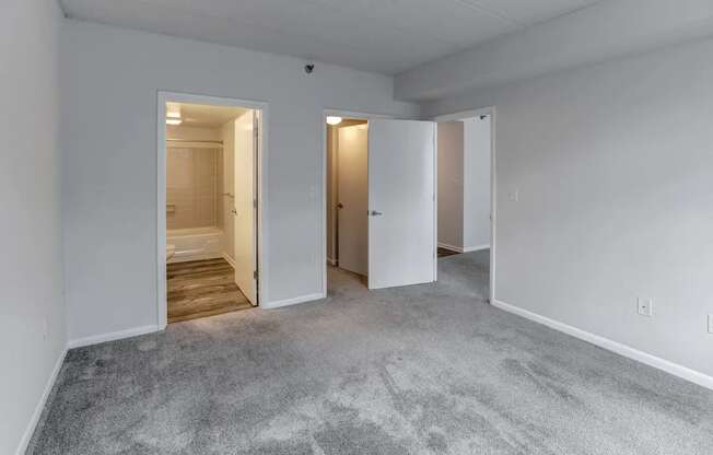 a bedroom with a carpeted floor and white walls