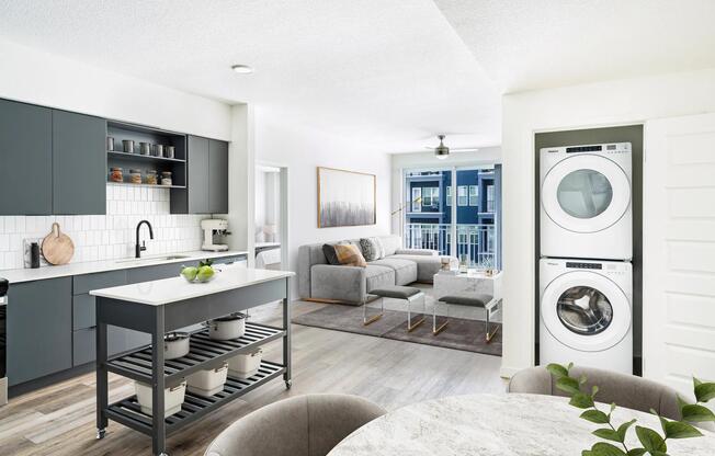A bright, open layout featuring a dark-cabinet kitchen, movable island, and in-home washer and dryer, creating everyday ease at Modera Encore in Tampa.