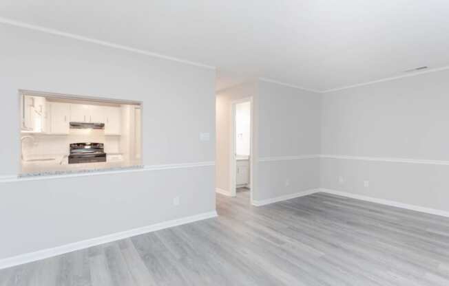 an empty living room with white walls and a fireplace  at Henley, North Carolina, 28311