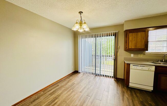 {7209} Spacious Townhome Available Immediately + Fresh Paint & New Carpeting + Two Car Garage