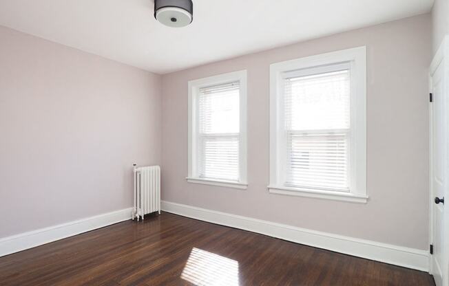 Room with window and wooden floor at The Packard, West Hartford