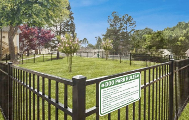 a dog park with a sign on a fence