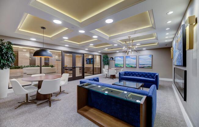 a room filled with furniture and a large window
