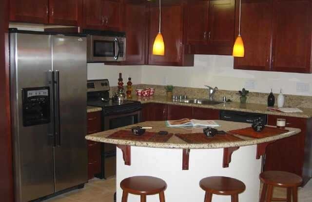 Beautiful upscale top floor 1 bedroom & 1 bath open concept condo - bright end unit with one reserved parking space. Amenities include: granite kitchen and bath, cherry wood cabinets, SS appliances, in unit washer & dryer, mirrored closet with custom cont