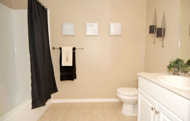 Bathroom with bathtub, white toilet and  sink