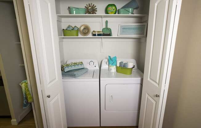 Model home laundry room and shelves