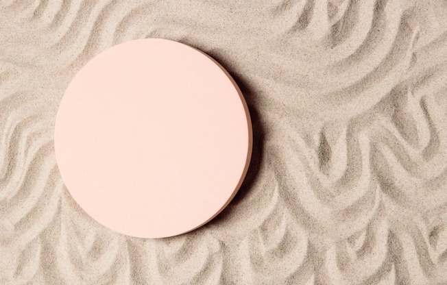 Pink mirror sitting on the sand  at Sono Central Residential, Connecticut