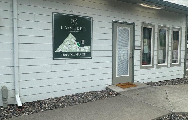 A white building with a Laverde sign on the front.