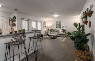 A living room with a bar area and a couch.