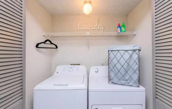 a kitchen with a sink and a refrigerator