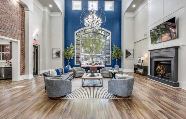 a living room with a blue wall and a fireplace