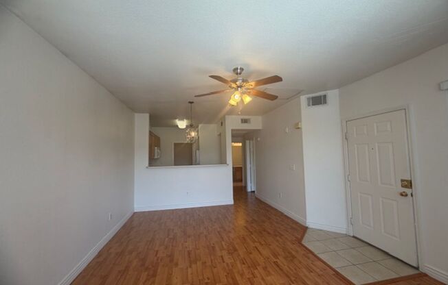 GUARD GATED TOP FLOOR PRIVATE 1 BED CONDO FEATURING A DETACHED 1 CAR GARAGE