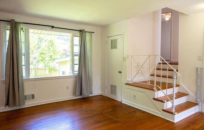 Charming Split-Level Home with Bright Interiors and Spacious Backyard