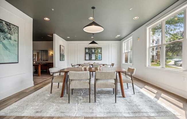 A modern co-working space with a large table and chairs.