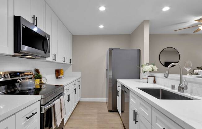 kitchen in a bedroom plus den unit.