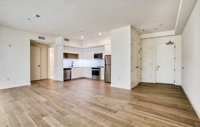 A spacious kitchen with a dining area and a living room.at The Dillon, Los Angeles California