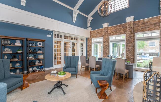 a living room filled with furniture and a large window