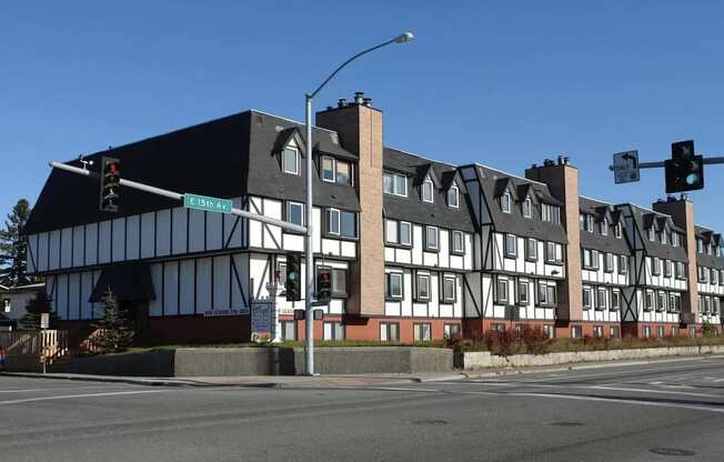 a new building on the corner of a street with a traffic light at Kings Court, Anchorage, AK ? 