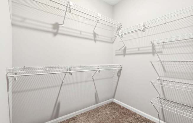 Empty white shelves in a room.