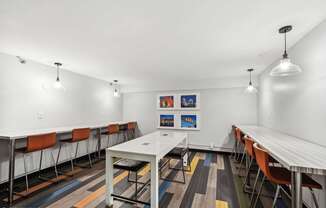 A conference room and office with white table and chairs