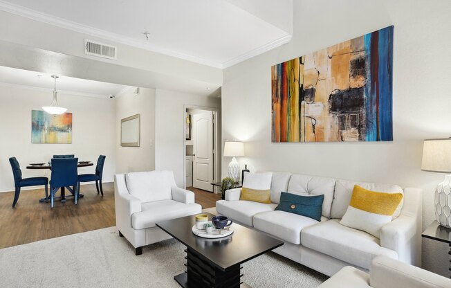a living room with a couch and a coffee table at La Ventura Apartments, Texas, 75093