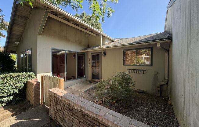 Spacious 3 Bedroom Home with Multiple Living Areas, Two Fireplaces, Hardwood Floors & Outdoor Patio