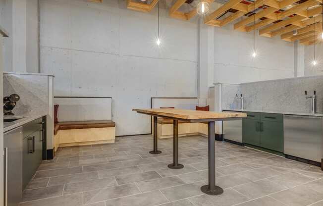 a kitchen with stainless steel appliances and a wooden table