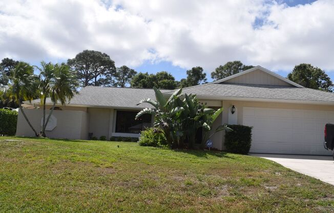 Centrally located 3 bedroom 2 bath home with in a nice tropical setting