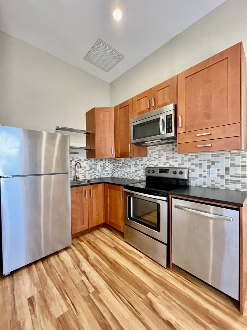 This location can't be beat! 1 Bedroom Unit w/ Fenced In Yard