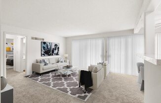 a living room with white furniture and a rug
