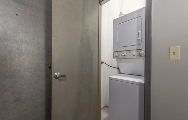 a small laundry room with a washer and dryer