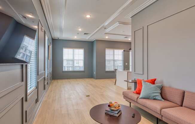 a living room with a couch and a coffee table at The Bella at Westchester, Midlothian