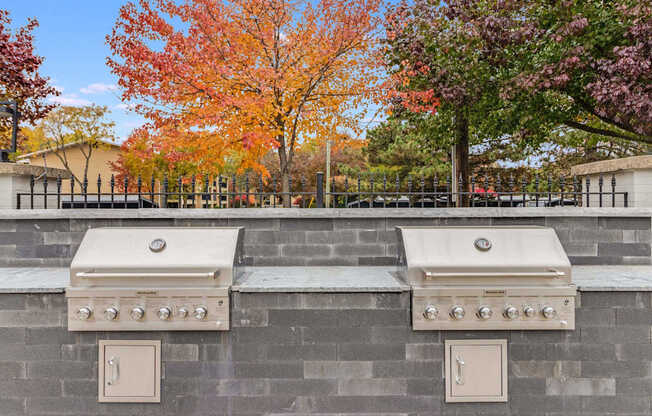 Two grills are built into a wall.