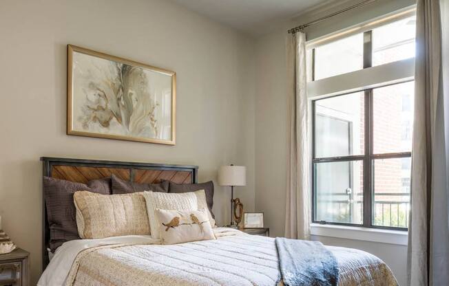 spacious bedroom with a ceiling fan at Tinsley on the Park apartments