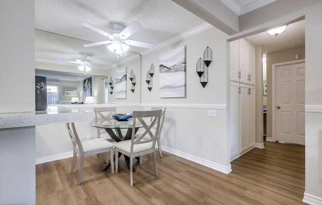 a kitchen with a wood floor in a room