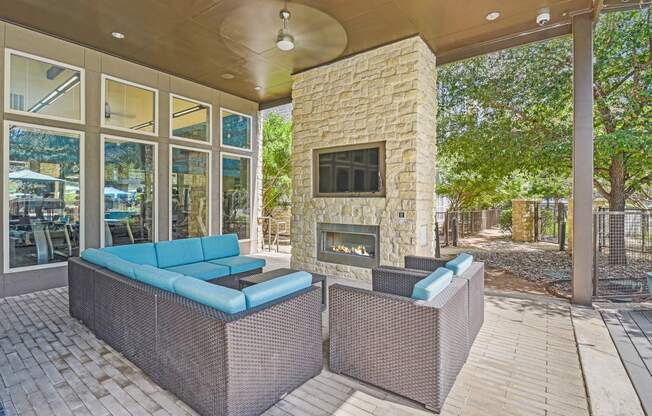 the preserve at ballantyne commons patio with couches and a fireplace