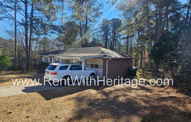 Great Brick Ranch / Harwood Floors / Huge Shop or Extra Storage / No Garage / Great Private Back Yard/ Great Location