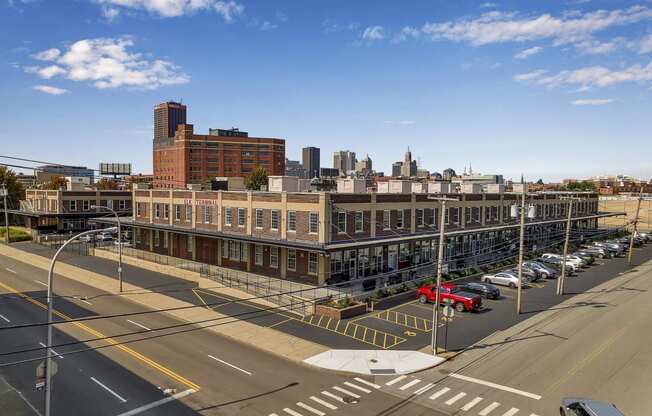 an aerial view of a city street and a large building at The Lofts at Elk Terminal, Buffalo, NY, New York, 14204