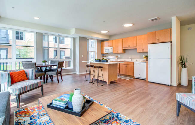 Modern Living Room With Kitchen View at The Legends at Berry 62+ Apartments, St. Paul, Minnesota