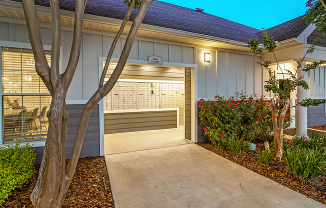 a walkway leading to a garage door of a house at Avalon Apartment Homes, Starkville, MS, 39759